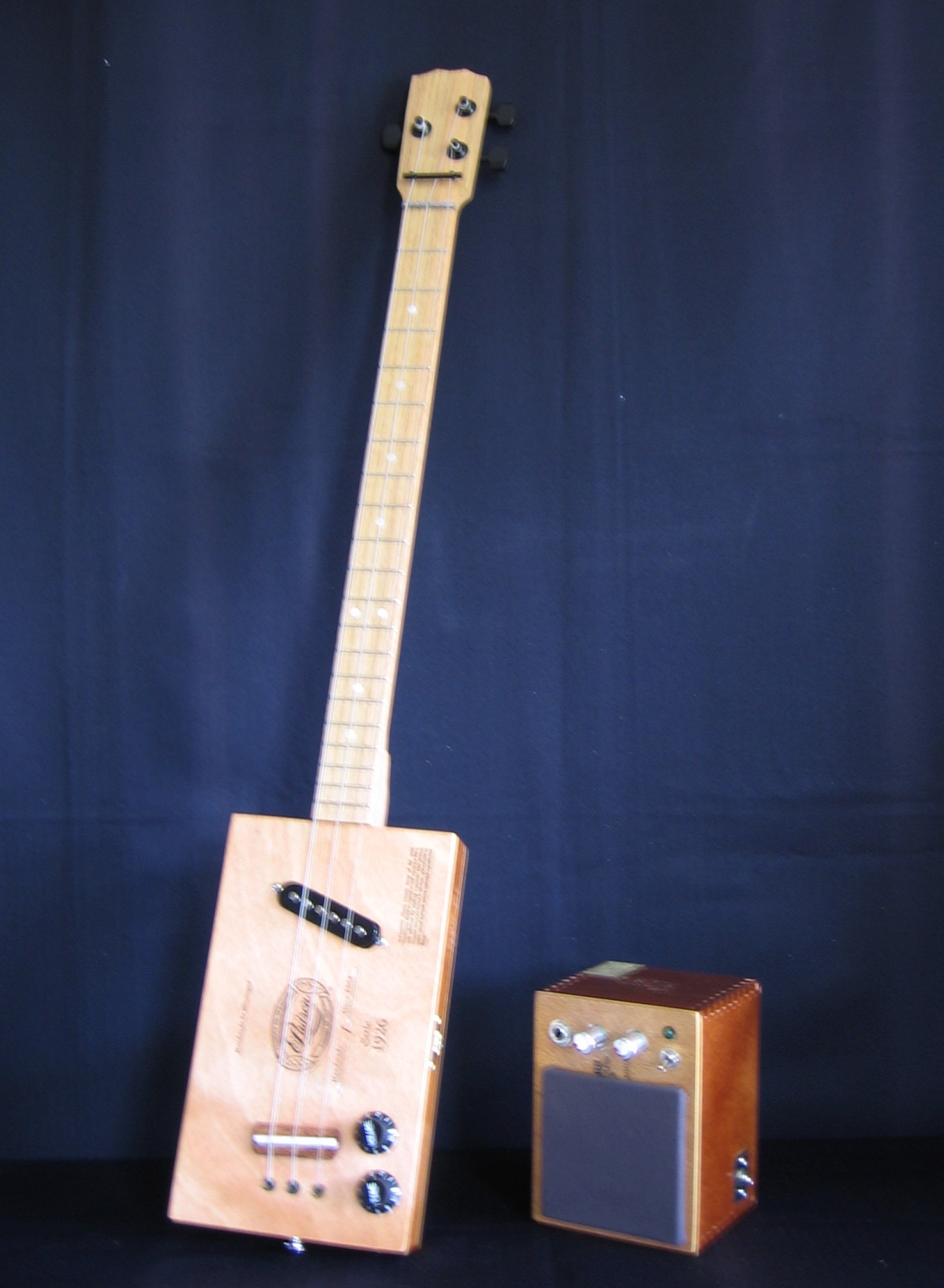 three string guitar and amp